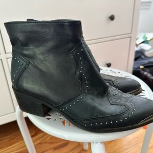 The front has a metal front, looks brass in the photo but it is silver